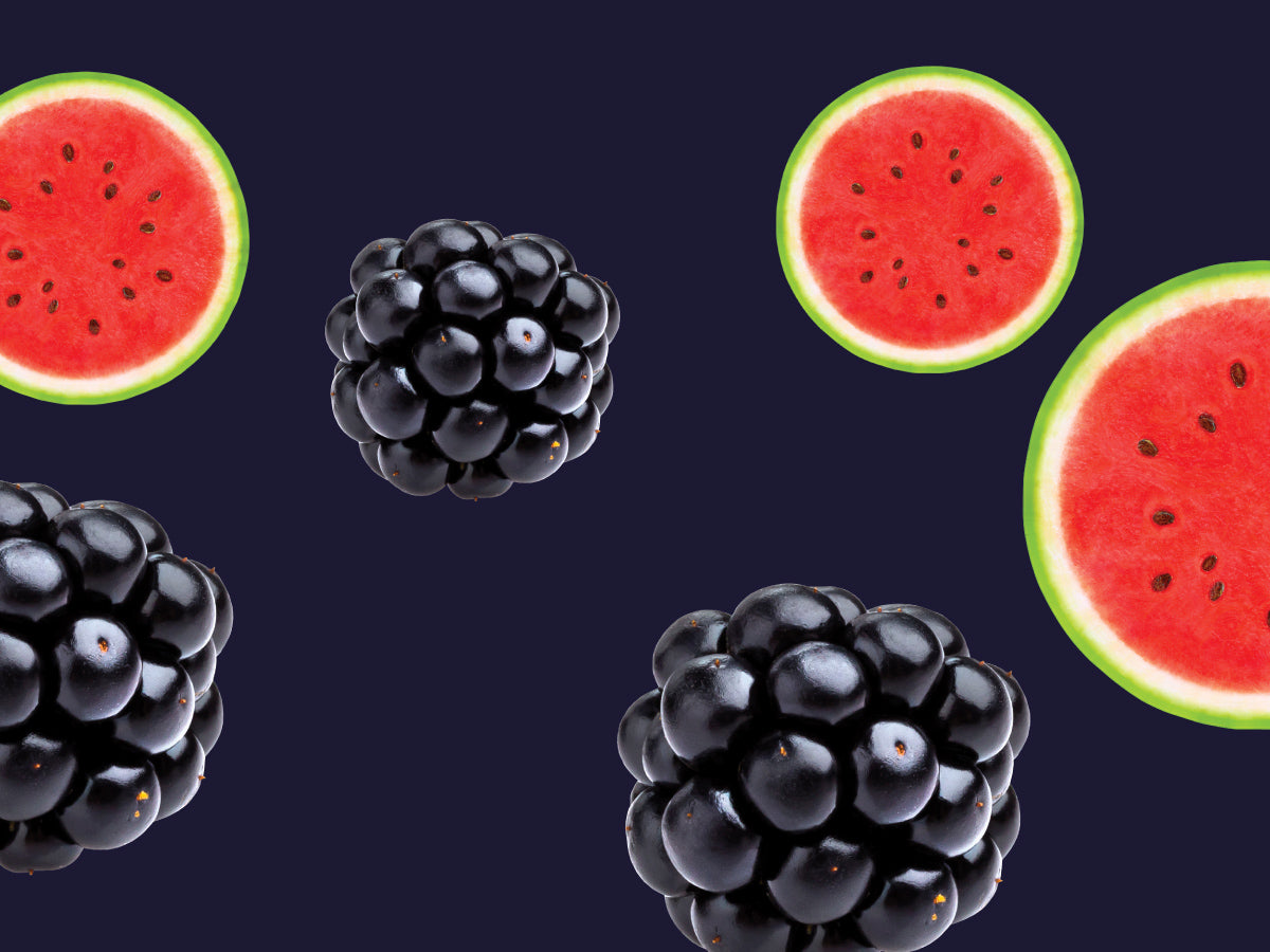 Blackberries and watermelon slices on a dark background
