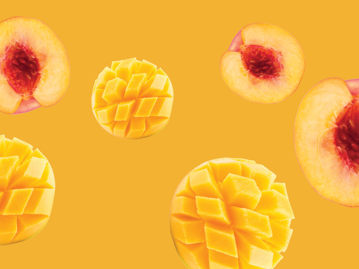 Mangoes and peaches on a yellow background