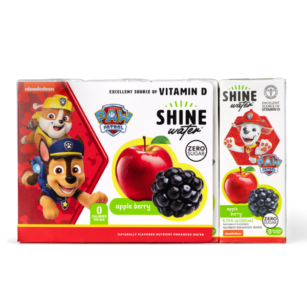 Two boxes of Paw Patrol Shine vitamin enhanced Water with apple and berry flavor on a white background