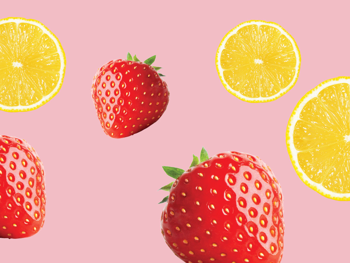 Strawberries and lemons on a pink background