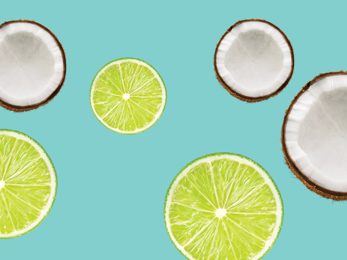 Coconuts and lime slices on a turquoise background